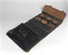 (SALESMAN SAMPLE SUITCASE--HEADSTONES) A complete door-to-door gravestone salesmans leather briefcase, containing 46 large format phot